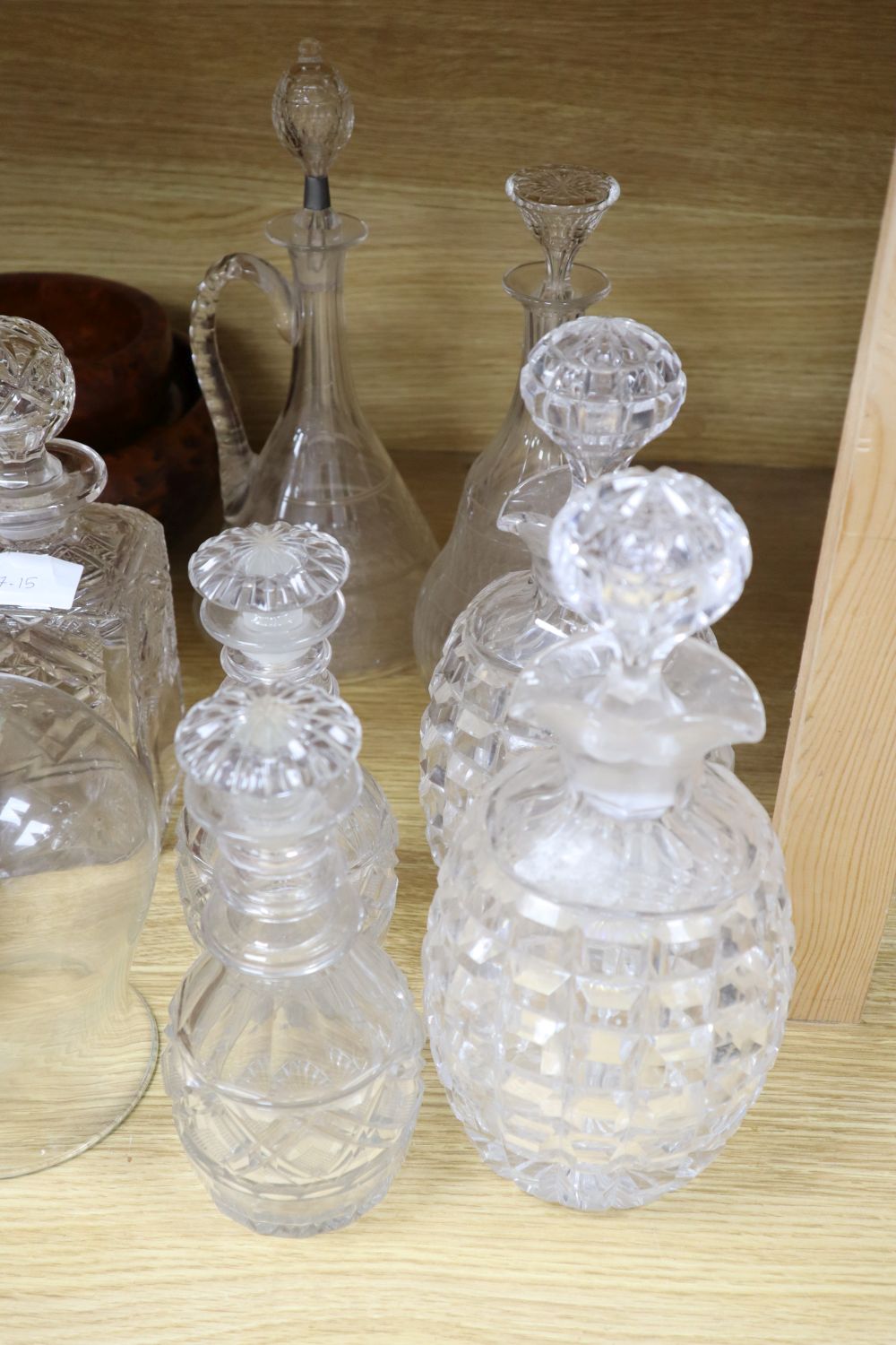 A quantity of cut glass decanters and treen
